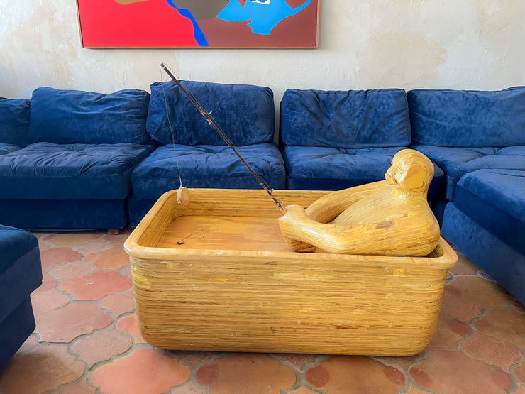 Wooden Man Fishing in a Bathtub by Hy Farber