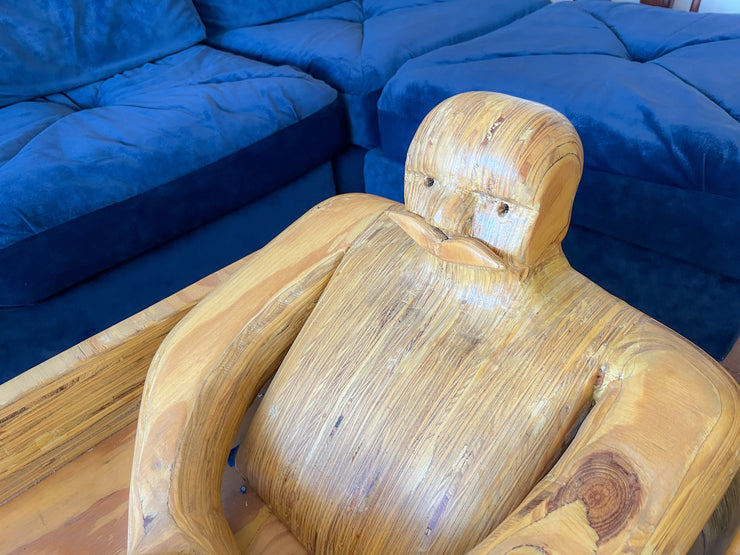 Wooden Man Fishing in a Bathtub by Hy Farber