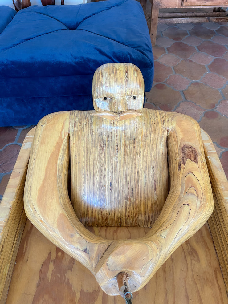 Wooden Man Fishing in a Bathtub by Hy Farber